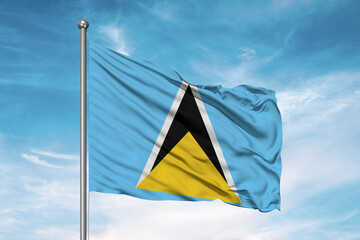 Saint Lucia national flag cloth fabric waving on beautiful sky Background.