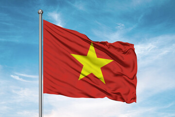 Vietnam national flag cloth fabric waving on beautiful sky Background.