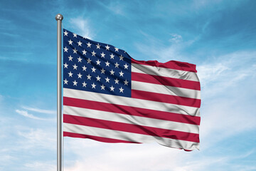 United States national flag cloth fabric waving on beautiful sky Background.