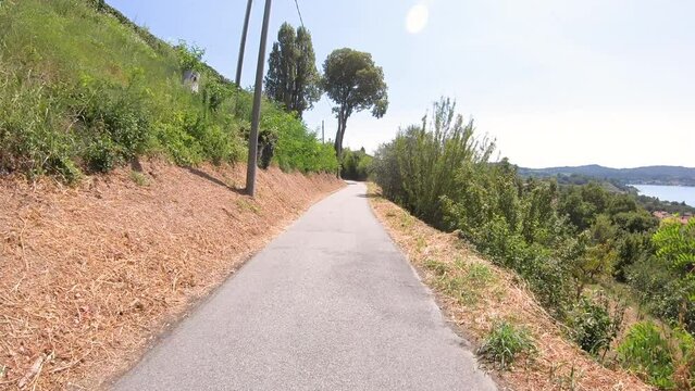 Via Francigena - paved road along the lake of Viverone,  Province of Biella, Piedmont region, Italy 