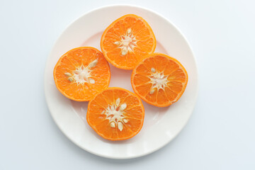 close up of slice of orange fruit on wooden background 