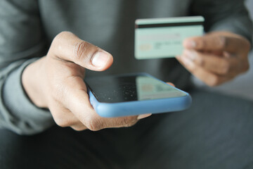 hand holding credit card and smart phone shopping online 