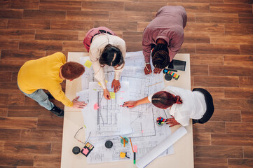 Multiracial team of engineers or architects having a meeting in an office