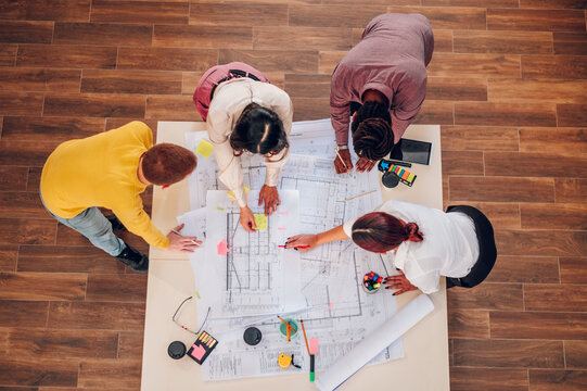 Multiracial team of engineers or architects having a meeting in an office