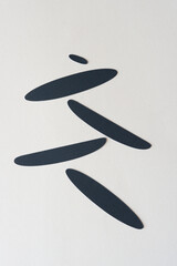 set of black paper shapes on blank paper
