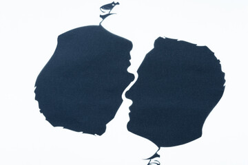 country map of two male silhouetted heads placed upside down on a white background
