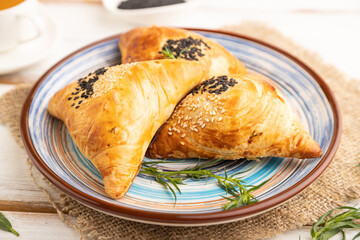 Homemade asian pastry samosa on white wooden. side view, selective focus.