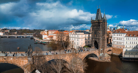 Naklejka premium Scenic spring panoramic aerial view of the Old Town pier architecture and Charles Bridge over Vltava river in Prague, Czech Republic