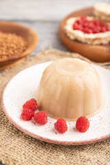 Buckwheat milk jelly on gray wooden, side view, selective focus.