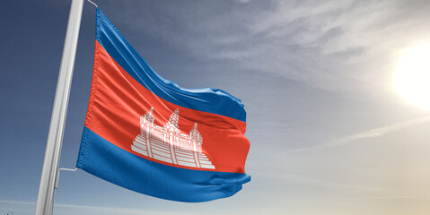 Cambodia national flag cloth fabric waving on beautiful sky grey Background.