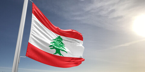 Lebanon national flag cloth fabric waving on beautiful sky grey Background.