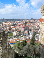 A view of Lisbon's cityscape from above, including many siena coloured rooftops.  Image has copy space.