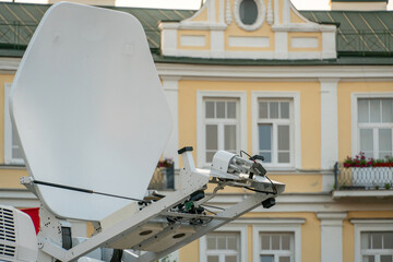 TV satellite dish on the roof of the car. The car of the television news service. Special transport...