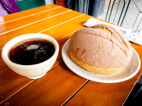 cup of coffee and mexicam bread