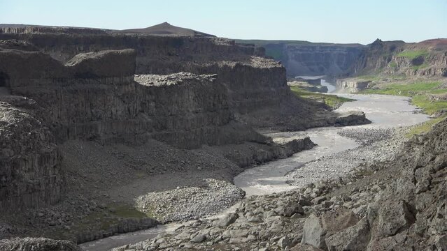 Fantastic landscape with flowing rivers and streams with rocks and grass in Iceland.