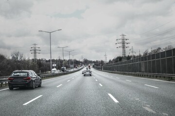 Fototapeta na wymiar Cars on speedway, vintage color effect, intentional blurring 