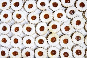 background of Traditional algerian cookies with apricot jam named in french sablé for eid mubarak