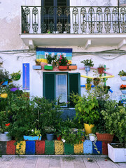 Fototapeta na wymiar Old colorful house with flowers