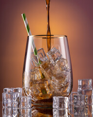 Cocktail Glass with Ice Cubes and Straw