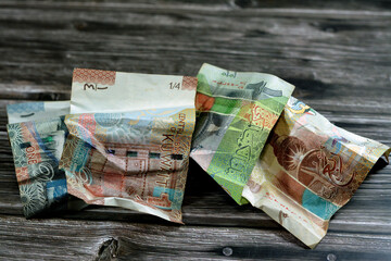 crumpled Kuwaiti money of quarter, half and one KWD Kuwait dinar bills banknote isolated, wrinkled...
