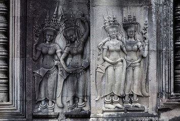 celestial dance of Apsara dancers on the walls of  Angkor Wat temple in Cambodia (bas-relief)