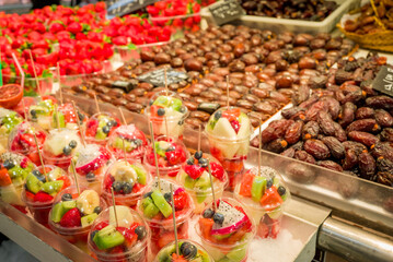 Fresh fruit juice Kiwi, Melons, Mango, Passion,  on ice at the market