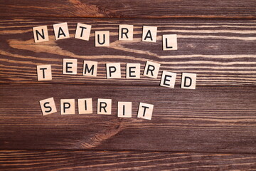 Word spirit, lettering on wooden background