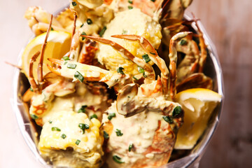 Parmesan cream seafood Bucket specials served isolated on background top view food