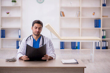 Young male doctor radiologist working in the clinic