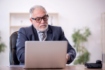 Old male employee and too much work at workplace