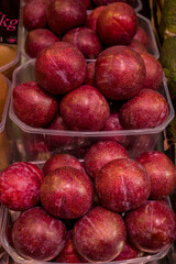 Plums fruit on the market for background