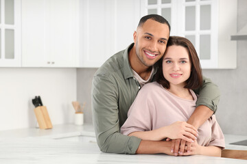 Obraz premium Dating agency. Happy couple spending time together in kitchen, space for text