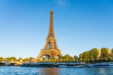 Fototapeta na wymiar Eiffel Tower by Seine river in Paris