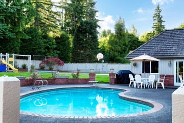 Heart shaped home swimming pool in large backyard - 593119374
