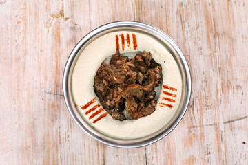 Hummus Shawarma served in dish isolated on background top of arabic food cold mezza
