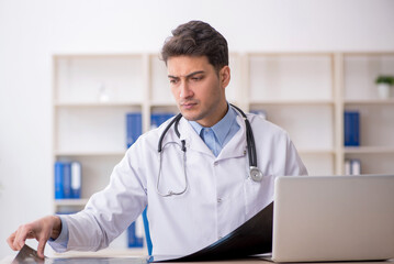 Young male doctor radiologist working in the clinic