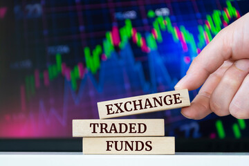 Wooden blocks with words 'Exchange Traded Funds'. Business concept