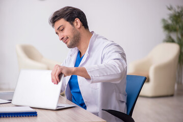 Young male doctor in telemedicine concept