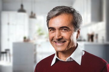 Relax, happy elderly man posing in home