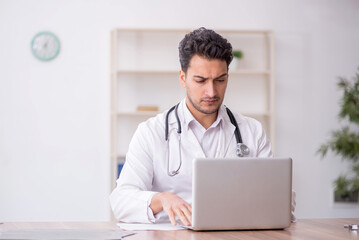 Young male doctor in telemedicine concept