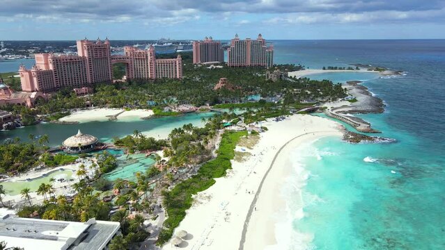 Beautiful cinematic aerial view of the Bahamas Beautiful cinematic aerial view of the Bahamas beaches with turquoise water ocean and people walking and enjoying the sand