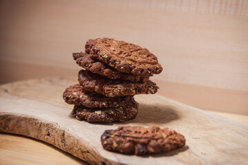 homemade Cereal cookies or protein biscuits on wooden cutting board .rustic healthy eating .