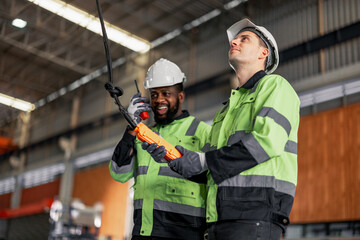 Experienced sheet metal workers use a computerized metalworking control panel display to create and regulate heavy gear. Automating and streamlining the placement of roofing modules for installation.