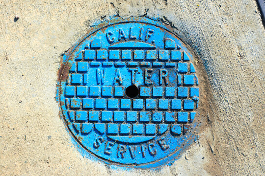 Colorful Utility Cover Is Cast With Striking Patterns And Conveys An Aging Industrial Era