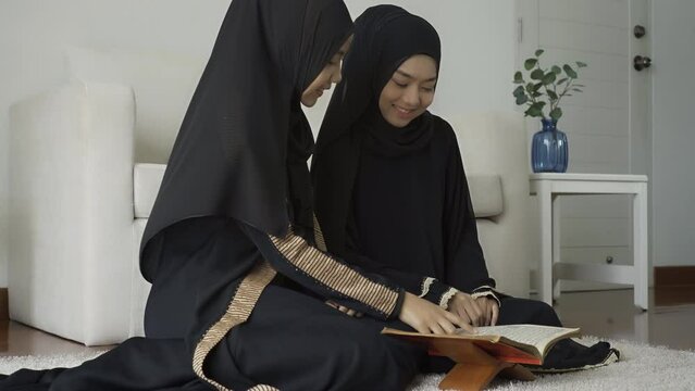 An Asian Muslim women reciting Salah or Salat al-Fatiha passage of the Qur'an, in a single act of sujud called a sajdah or prostrations at home.
The Quran holy book is a public item