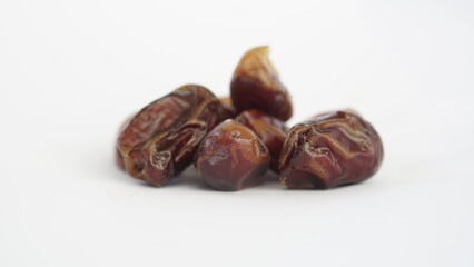 dried dates on a white background