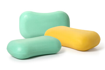 Pieces of green and yellow toilet soap on a white background. Full depth of field. With clipping path