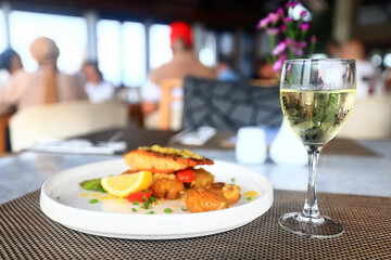 a glass of white wine in a restaurant, alcohol luxury background