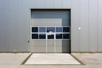 Truck door or loading dock of a warehouse. rolling gate for delivery vehicles. 