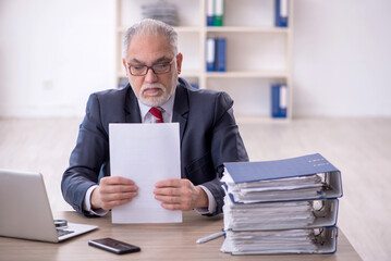 Old male employee and too much work in the office